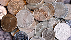 Various coins of the old inactive Republic of Estonia. Senti, krona 2001 coin close-up isolated on wooden background