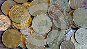 Various coins of the old inactive Republic of Estonia. Senti, krona 2001 coin close-up isolated on wooden background