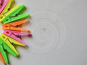 various color background of Cloth hanging plastic clips  on white background