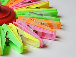 various color background of Cloth hanging plastic clips  on white background