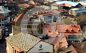Various, colored, beautiful roofs of the city of Tbilisi lit by the soft evening sun