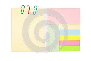 Various color note pad and paper clip isolated on