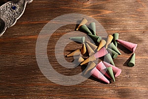 Various color and scent of cone incense on the wooden table