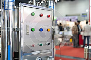 Various color select switch and push button lamp switch on off start stop at electric control cabinet for industrial