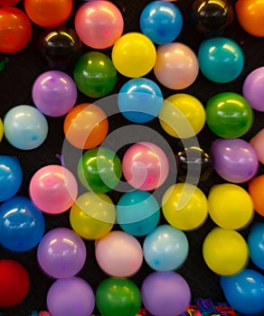 various colorful balloons on black background