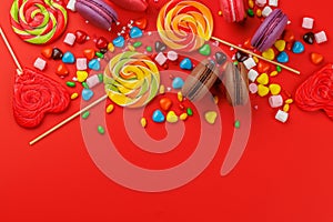 Various colorful candies, lollipops, and macaroons