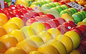 Various colorful fresh fruits on market stand