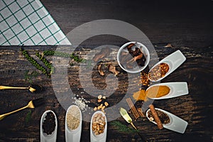 Various colorful herbs and spices on wooden table. Top view of spices and herbs. Spices and herbs over on wooden table background