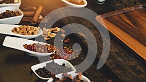 Various colorful herbs and spices on wooden table. Top view of spices and herbs. Spices and herbs over on wooden table background