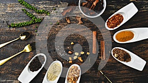 Various colorful herbs and spices on wooden table. Top view of spices and herbs. Spices and herbs over on wooden table background