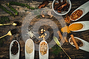 Various colorful herbs and spices on wooden table. Top view of spices and herbs. Spices and herbs over on wooden table background