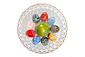 Various colorful stone eggs in the vase