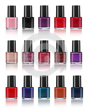 Various colors of nail lacquers, contained in transparent bottles