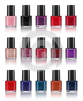 Various colors of nail lacquers, contained in transparent bottles photo