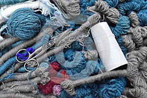 Various colors wool clews and scissors