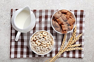 Various corn flakes with milk in jar