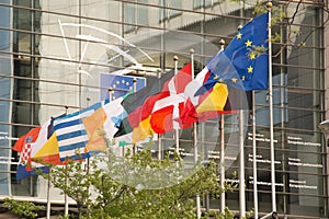 Various country flags in front of the European Parliament in Brussels, Belgium