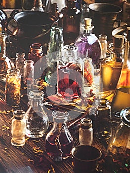 Various culinary oil in glass vial over wooden background-A Bottle with aromatic oil