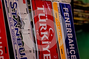 Various decorative license plates are displayed side by side.