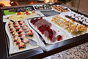 Various desserts in candy bar food buffet during hotel brunch