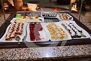 Various desserts in candy bar food buffet during hotel brunch