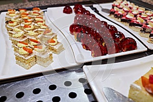 Various desserts in candy bar food buffet during hotel brunch