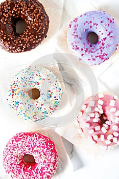 Various donuts on a colorful background.