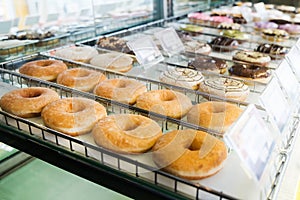 Various donuts on shelf