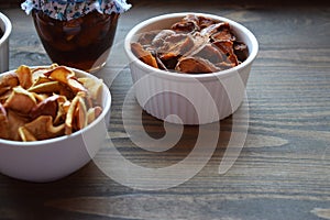 Various dried fruit displayed on an old wooden table.