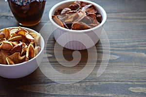 Various dried fruit displayed on an old wooden table.