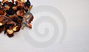 Various dried fruit displayed on an old wooden table.