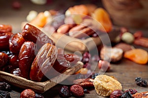 Various dried fruits and nuts in wooden dish