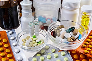 Various drugs in containers, bottles and blisters.