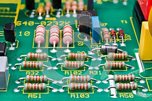 Various electronic components on detail of printed circuit board. Electrotechnics photo