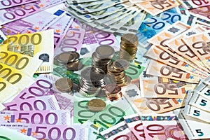 Various euro notes and coins as background
