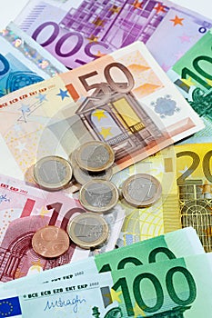 Various euro notes and coins as background