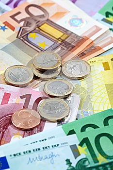 Various euro notes and coins as background