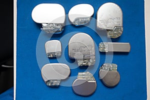 Various explanted pacemakers and defibrillators and event recorders photo