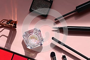 Various Eye Make Up on Pink Background