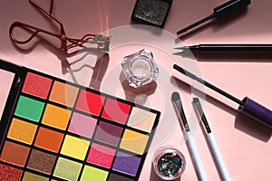 Various Eye Make Up on Pink Background