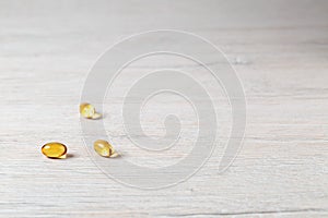 Various fish oil pills capsules on bright table