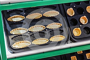 various forms for baking waffles and cakes in a pastry shop