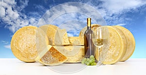 Various forms of cheese wine glass bottle sky background