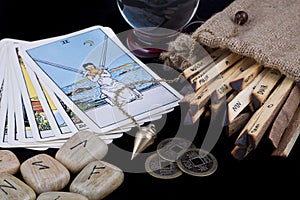 Various fortunetelling objects on black background