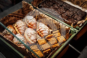 Various fresh bakery , pastry on display window, pie, chocolate and vanilla croissant