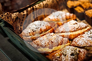 Various fresh bakery , pastry on display window, pie, chocolate and vanilla croissant