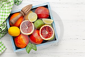 Various fresh citrus fruits in box. Bood orange, lime, lemon