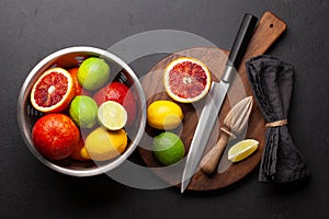 Various fresh citrus fruits in colander. Bood orange, lime, lemon