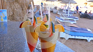 Various Fresh Exotic Cocktails or Juices in Glass with Straw on the Beach Bar. Egypt, Red Sea.