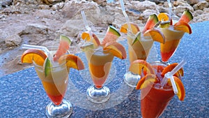 Various Fresh Exotic Cocktails or Juices in Glass with Straw on the Beach Bar. Egypt, Red Sea.